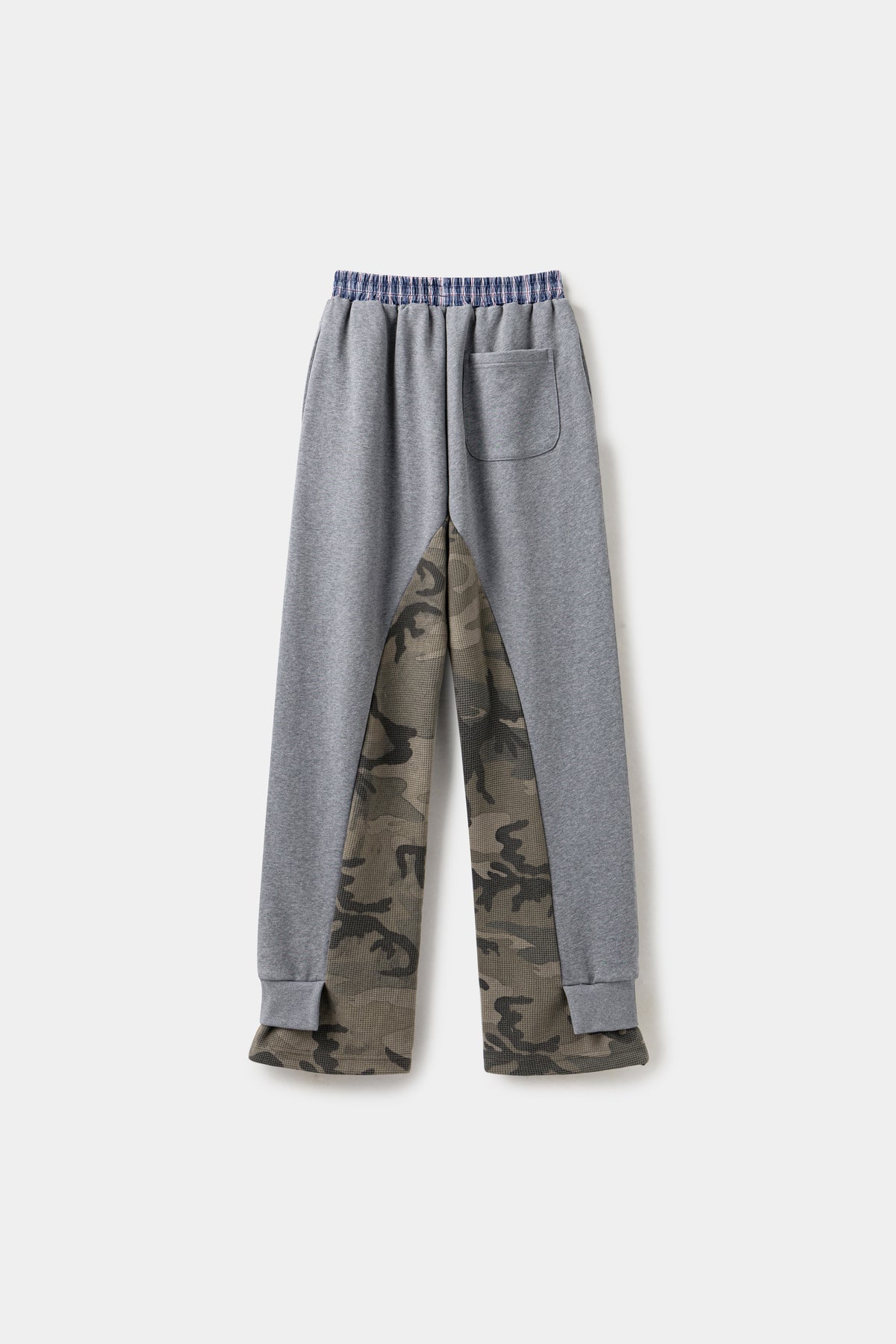Back view of the grey layered camo pants, with the waffle camo underlayer running down both legs.