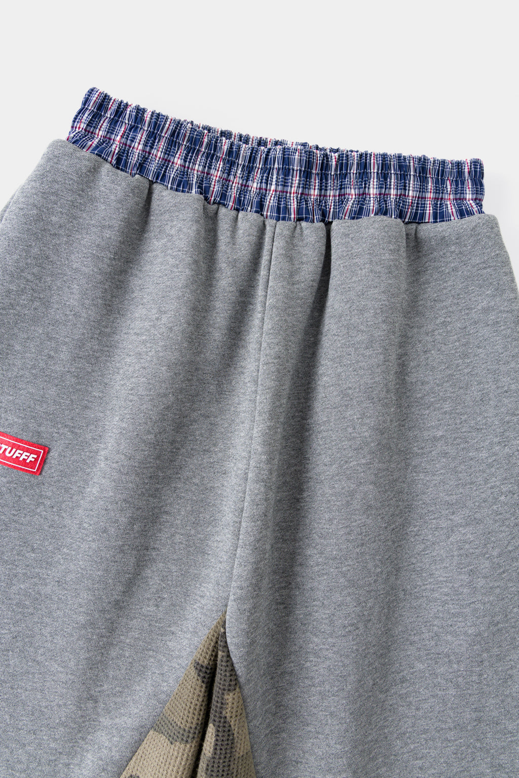 Close-up of the checked waistband trim and the red Ssstufff tab.