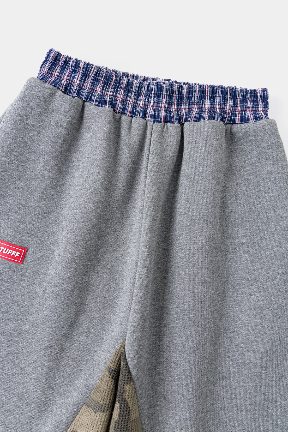 Close-up of the checked waistband trim and the red Ssstufff tab.