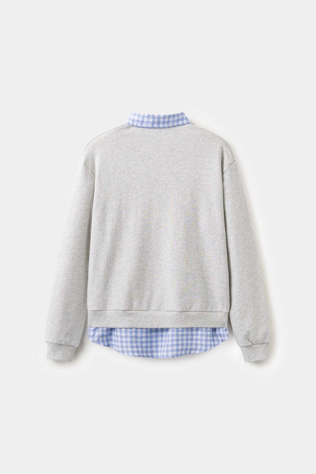 Back view of the grey layered shirt crewneck, with the gingham shirt tail at the hem.