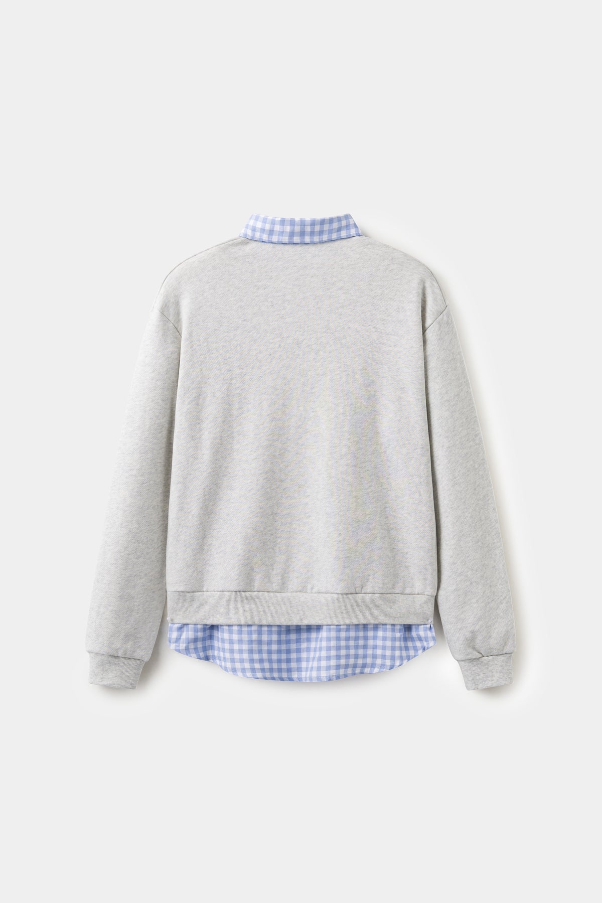 Back view of the grey layered shirt crewneck, with the gingham shirt tail at the hem.