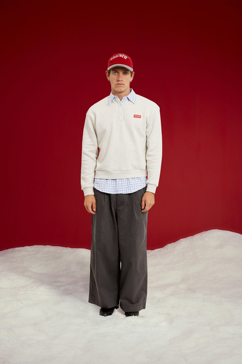 Layered Shirt Crewneck in grey marl, spliced with a blue gingham shirt collar and hem. Worn on a model, full-length front view.