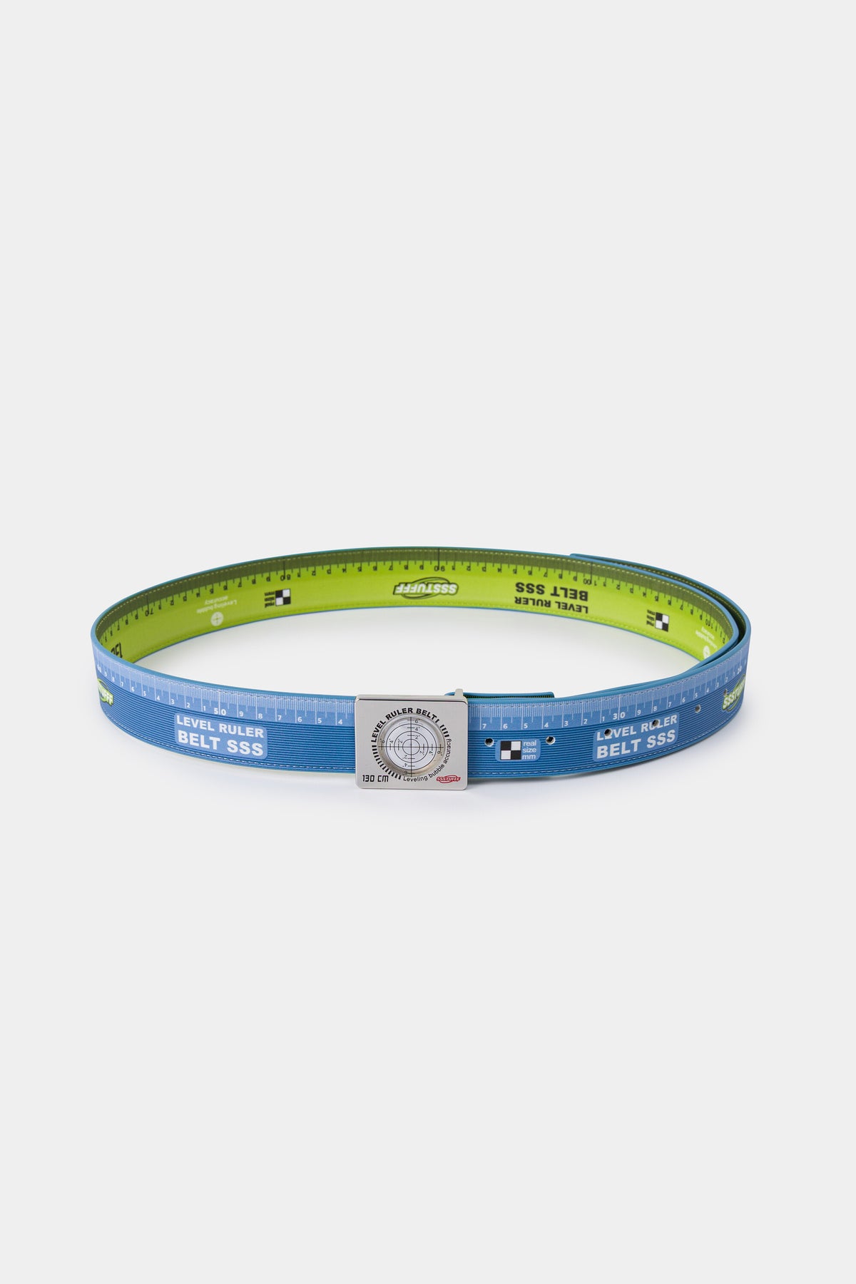 The belt turned over, showing the lime green reverse against the light blue ruler face.