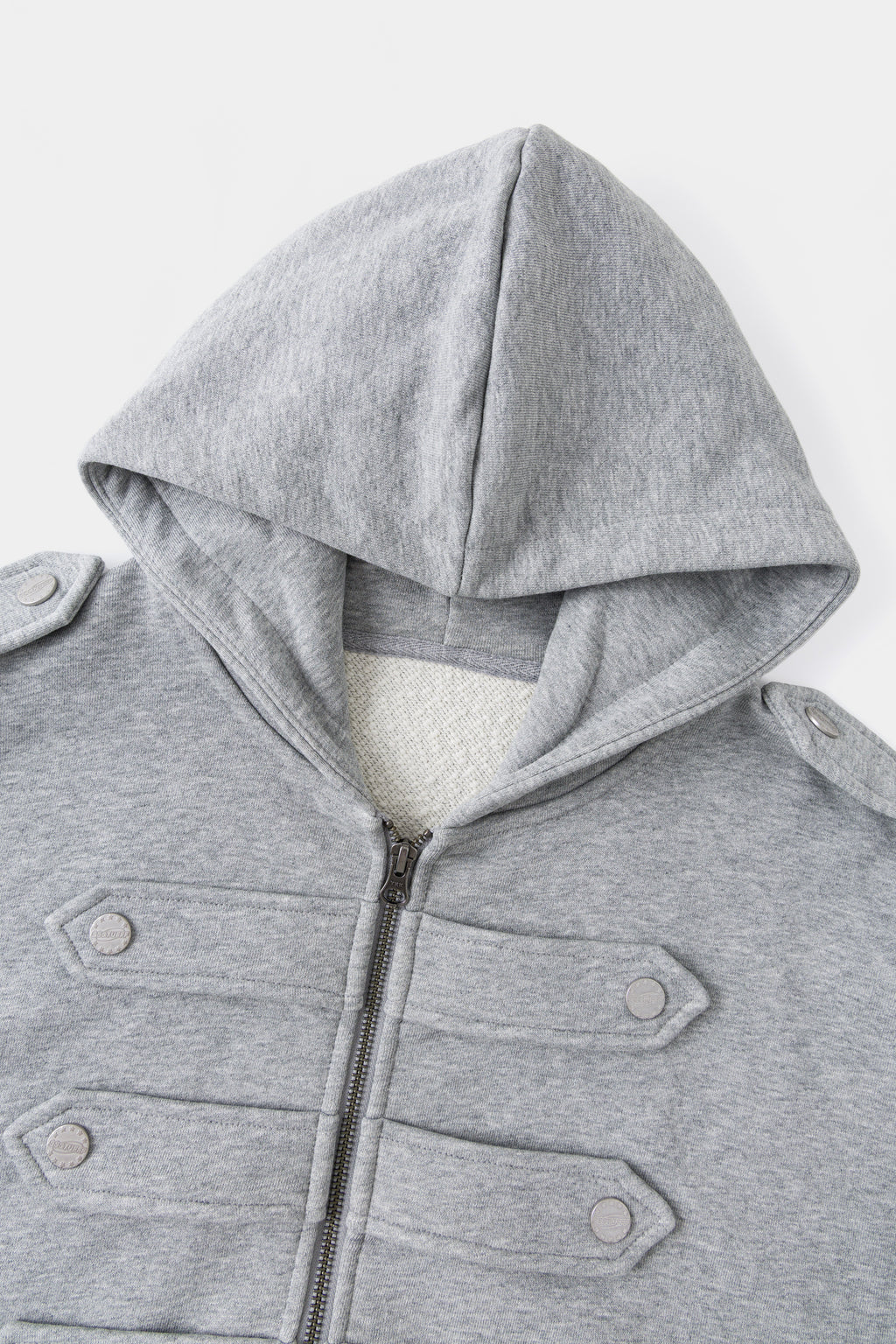 Close-up of the hood and the six snap-fastened chest closures.