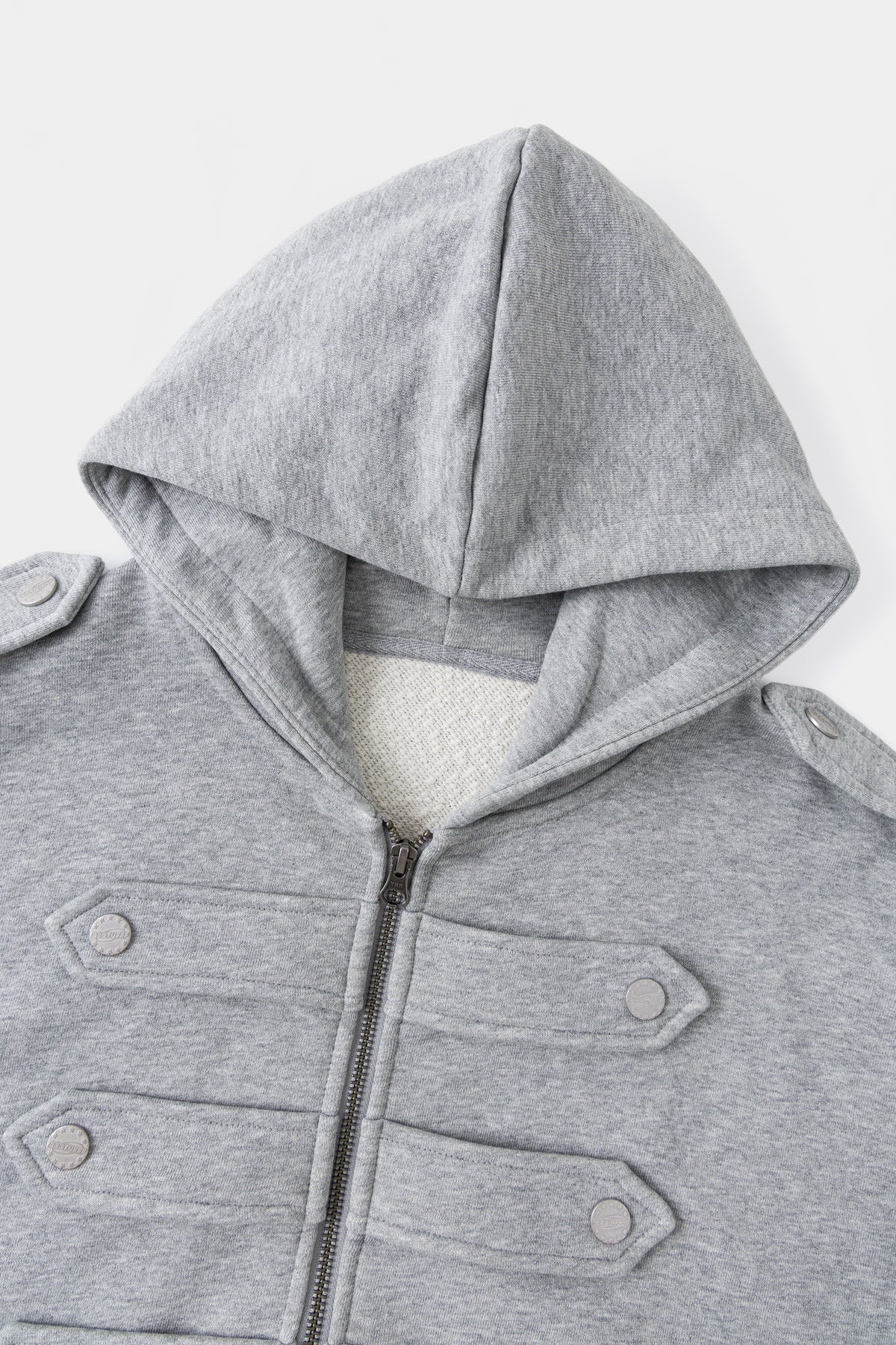 Close-up of the hood and the six snap-fastened chest closures.