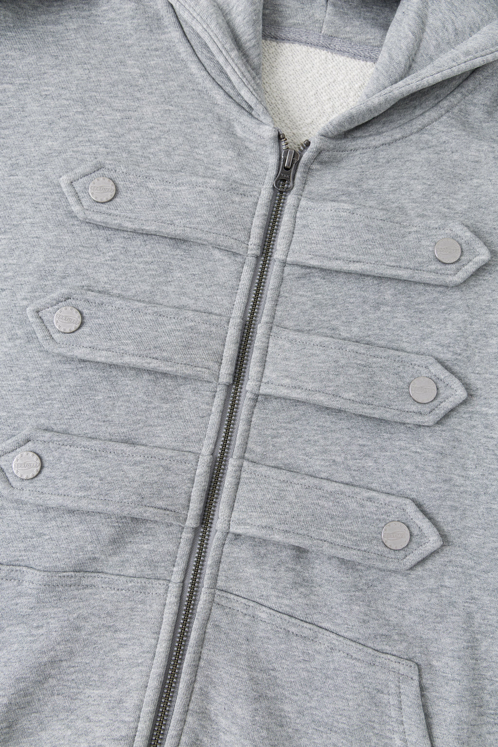 Close-up of the full-length zip between the marching-band closures.