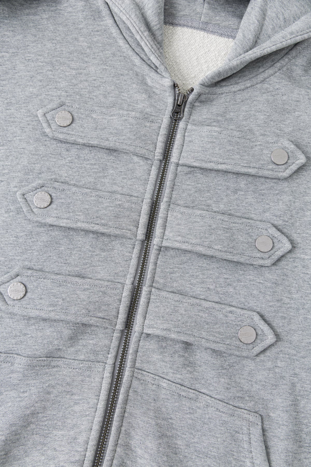 Close-up of the full-length zip between the marching-band closures.