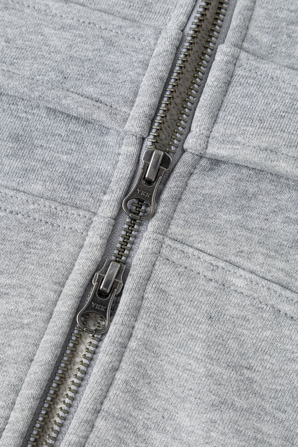 Detail of the chest pocket on grey loopback.