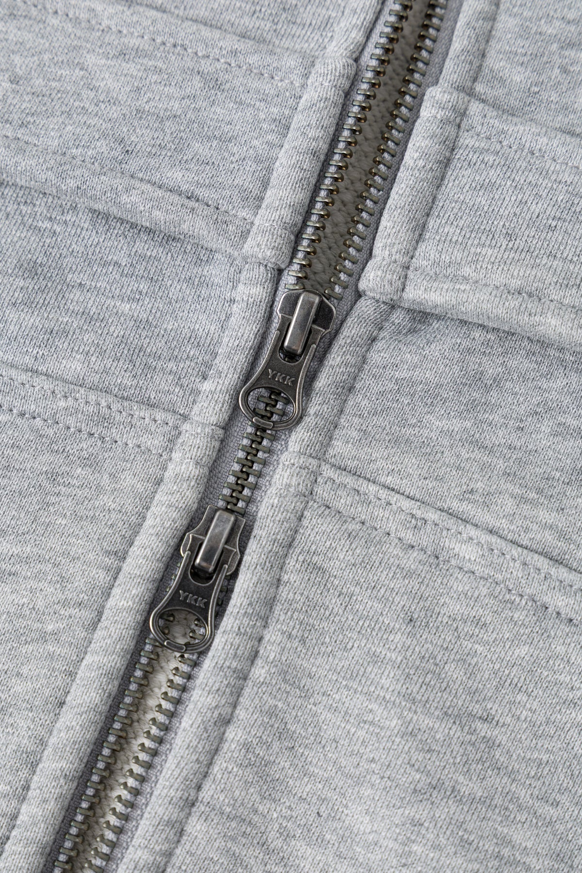 Detail of the chest pocket on grey loopback.