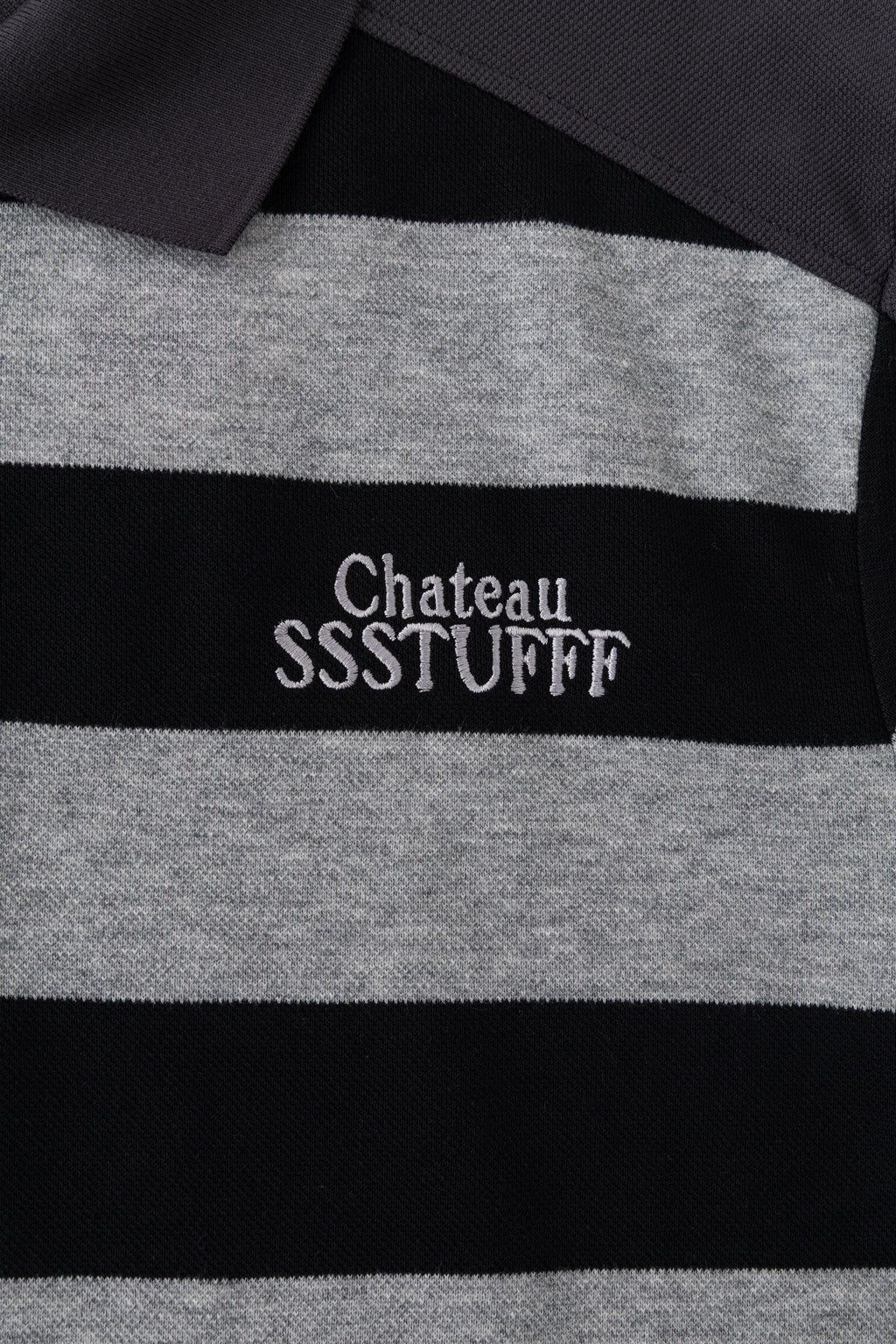 Close-up of the white Chateau SSSTUFFF embroidery on the grey stripe at the chest.