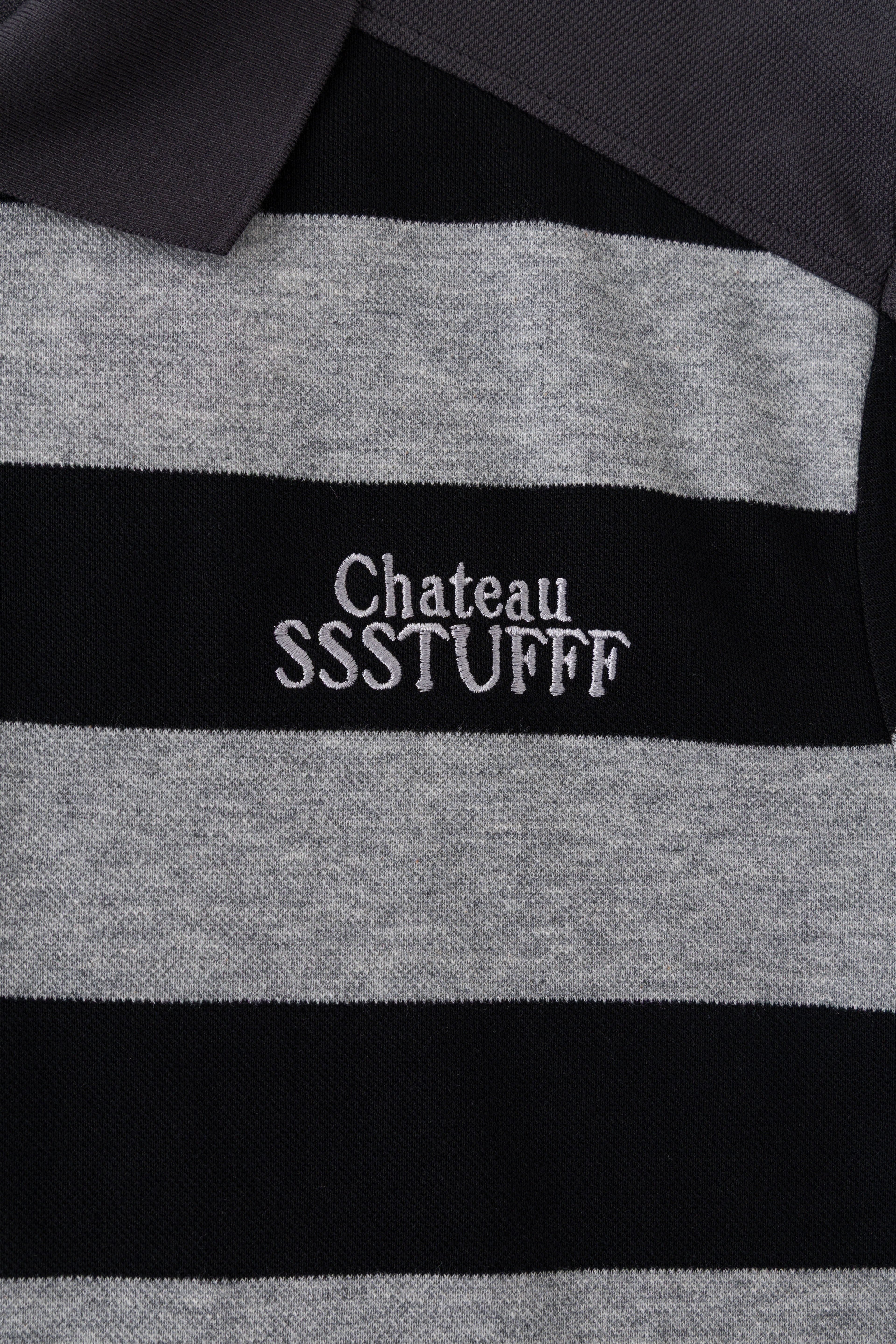 Close-up of the white Chateau SSSTUFFF embroidery on the grey stripe at the chest.
