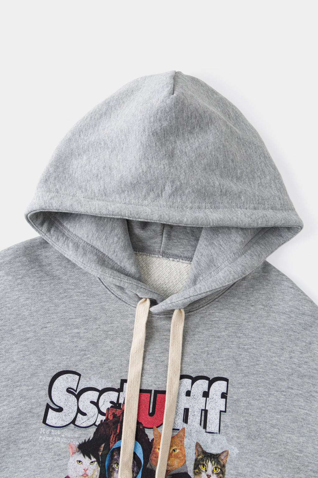 Close-up of the hood, natural drawcords and the top of the chest print.