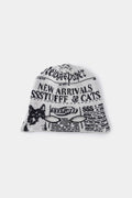 Newspaper Spy Beanie in newsprint jacquard, with two eye holes knitted into the front.