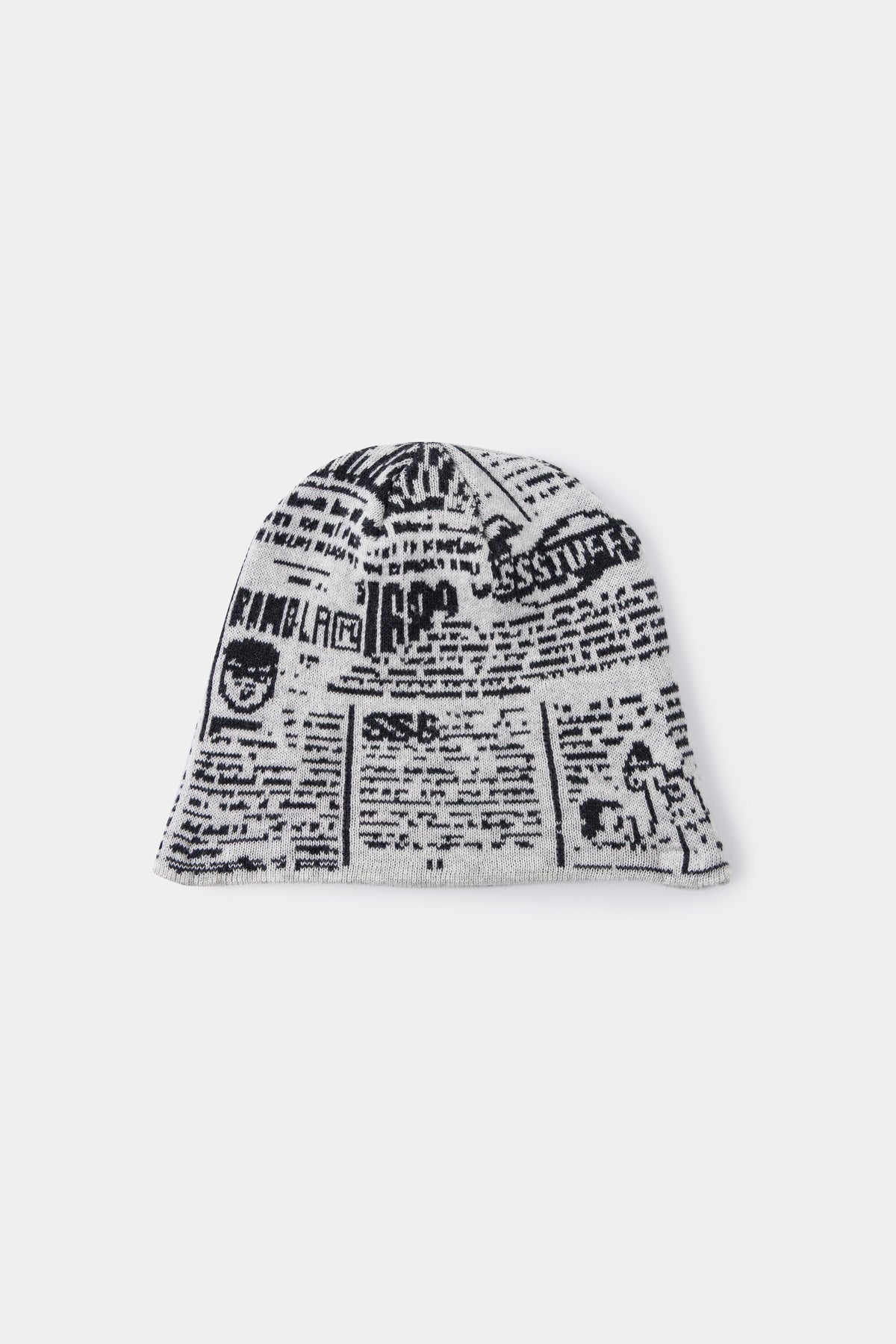 Back view of the newsprint beanie, covered in headlines and a small black cat.