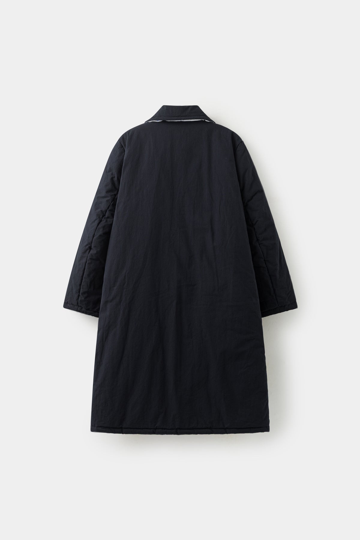 Back view of the coat on the plain black side.