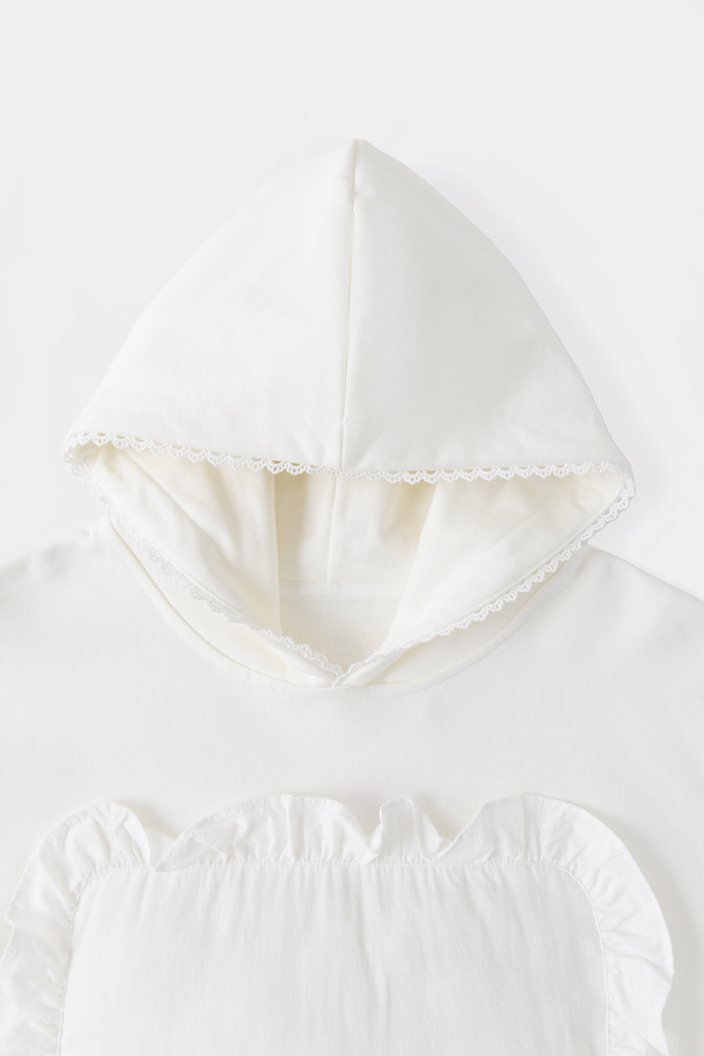 Close-up of the hood, edged in lace trim taken from hotel bed linen.