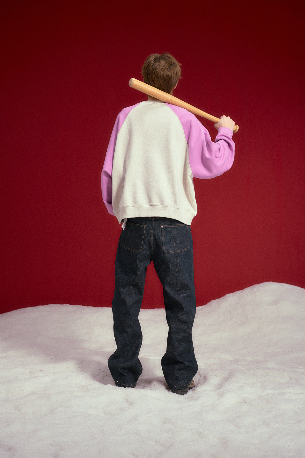 Raglan Pocket Crewneck in oatmeal marl with orchid sleeves, printed STFU 2027 at the chest. Worn on a model, full-length back view.