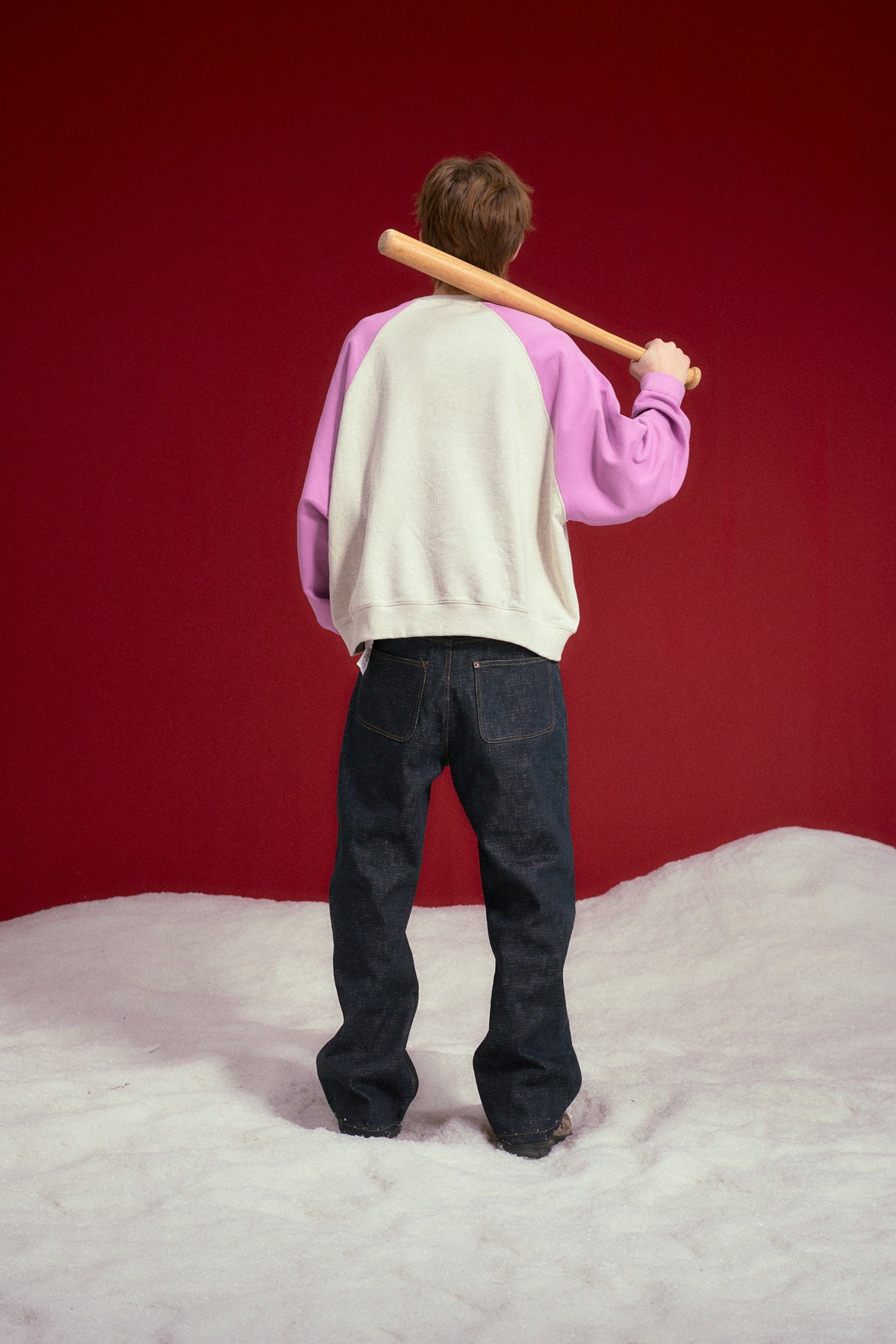 Raglan Pocket Crewneck in oatmeal marl with orchid sleeves, printed STFU 2027 at the chest. Worn on a model, full-length back view.