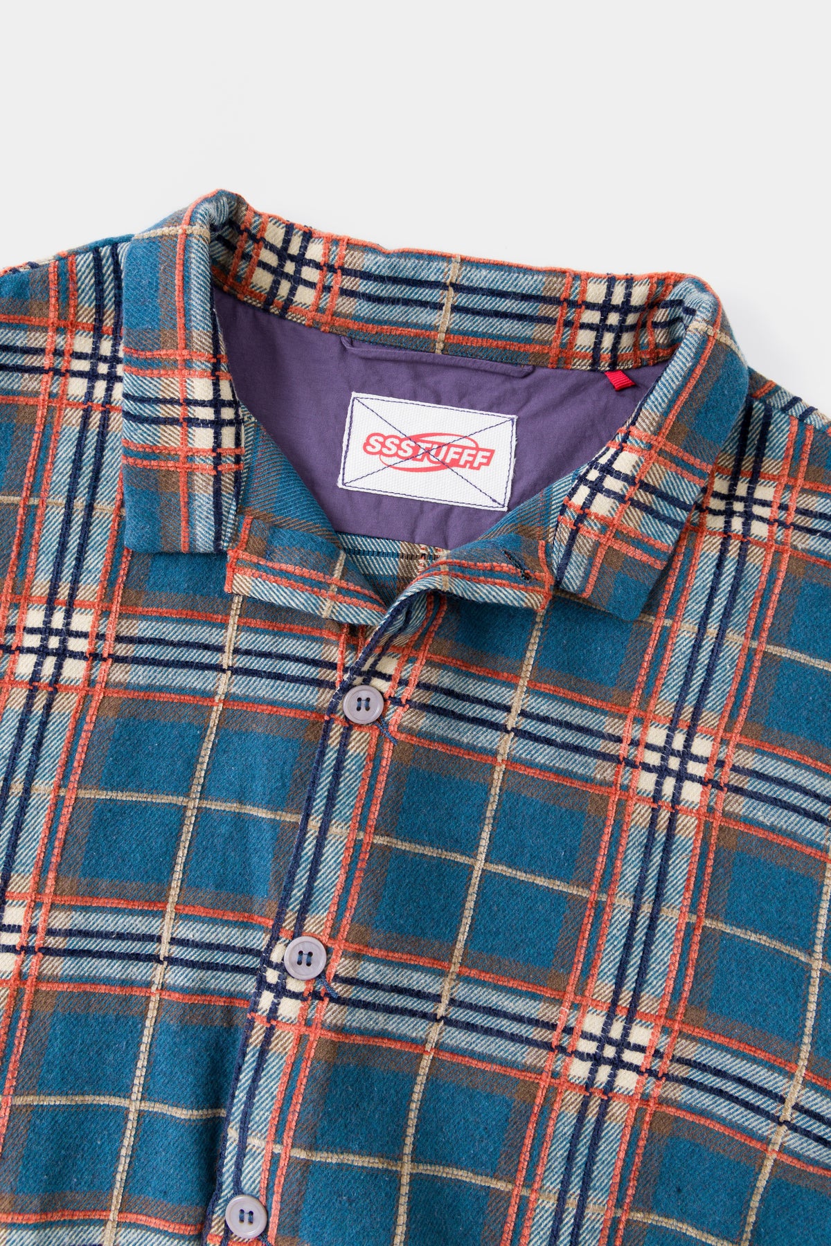 Close-up of the collar and the woven Ssstufff neck label.