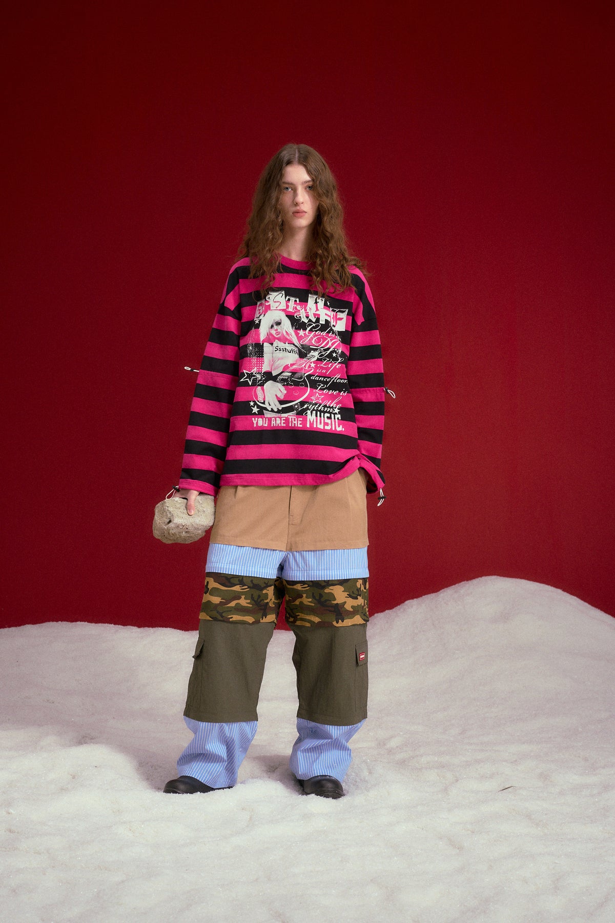Adjustable Rock Striped L/S Tee in pink and black stripes, printed with a rock poster graphic at the chest. Worn on a model, full-length front view.