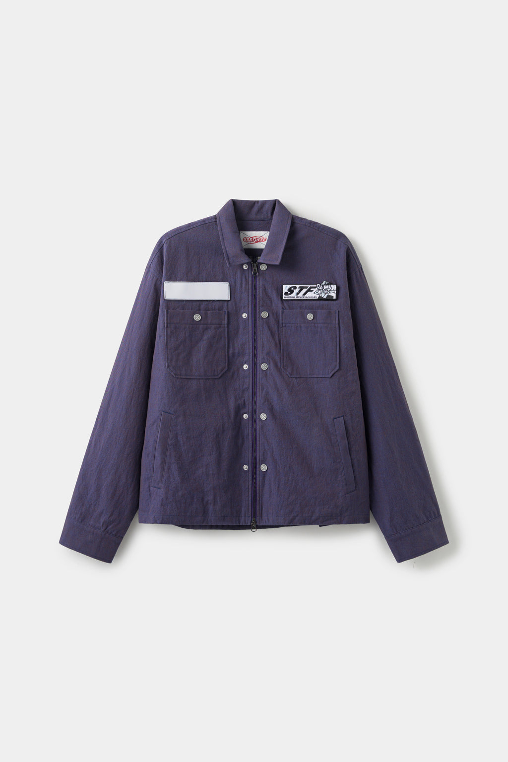 Secret Plumber Jacket in dark violet cotton twill, front view with the blank name patch and the STF Plumbing Services patch at the chest.