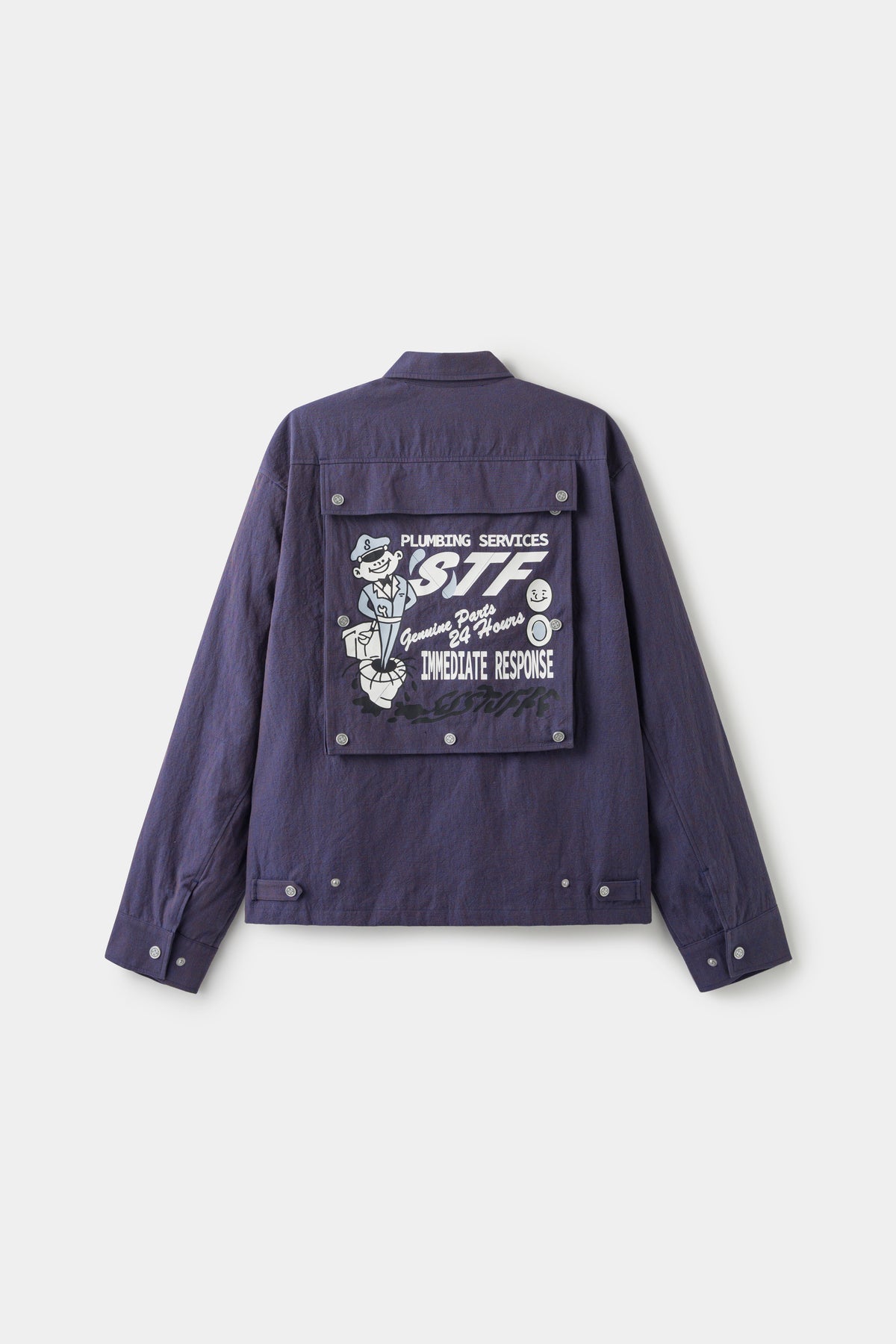 Back view with the back pocket flipped open, showing the STF Plumbing Services print.