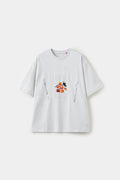 The Last Supper Tee in white, a short-sleeve crewneck with a small embossed plate, fork and knife print at the chest.