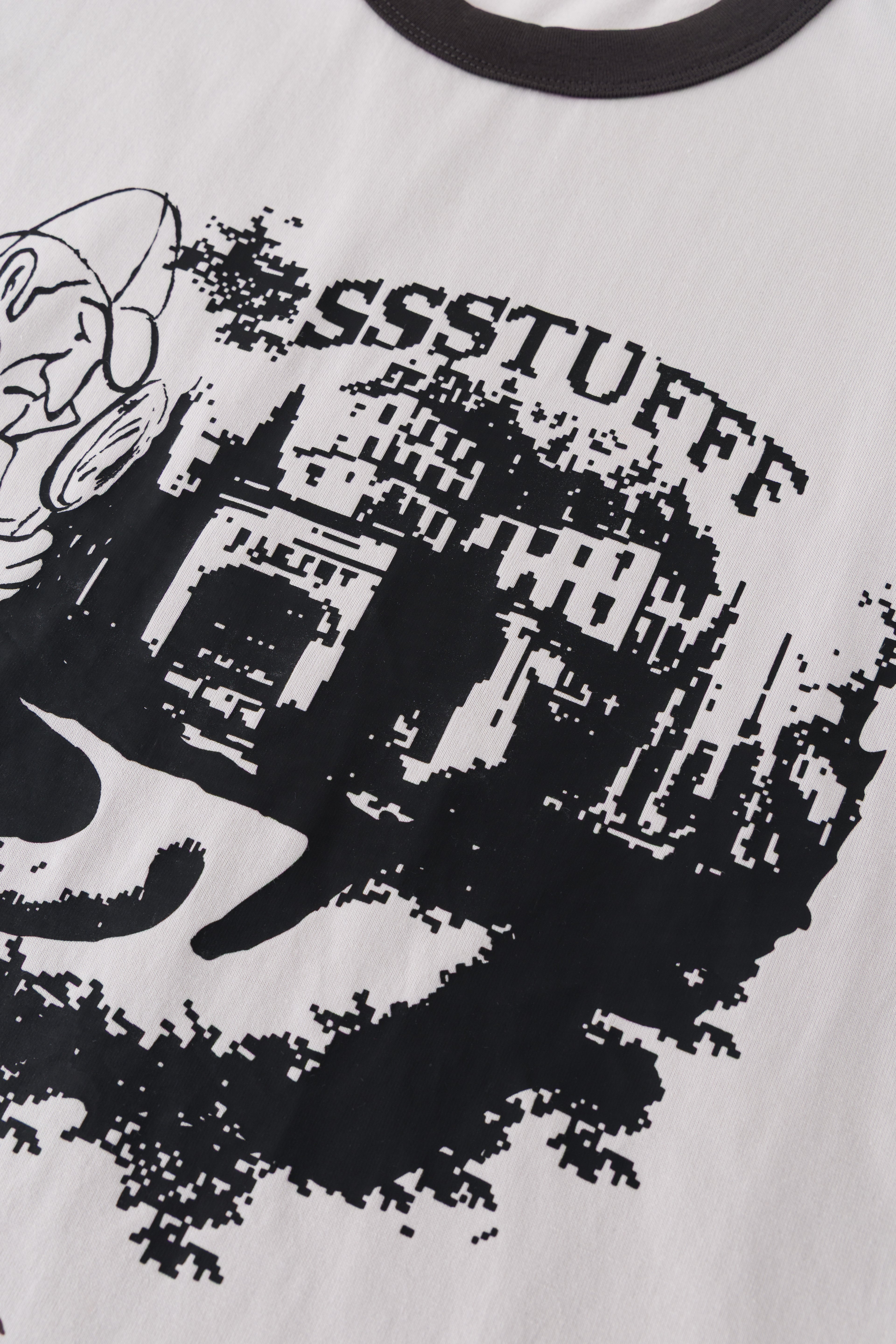 Detail of the arched SSSTUFFF lettering and city skyline in the front print.