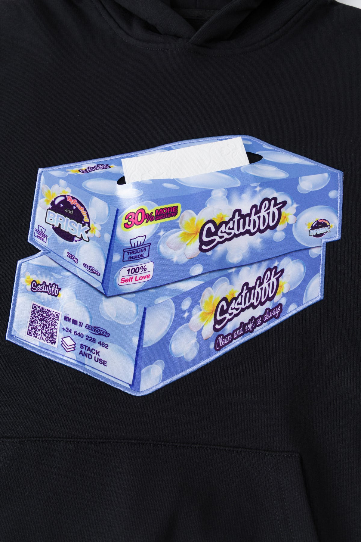 Close-up of the tissue box patch, with the elastic cord pulled out of the opening.