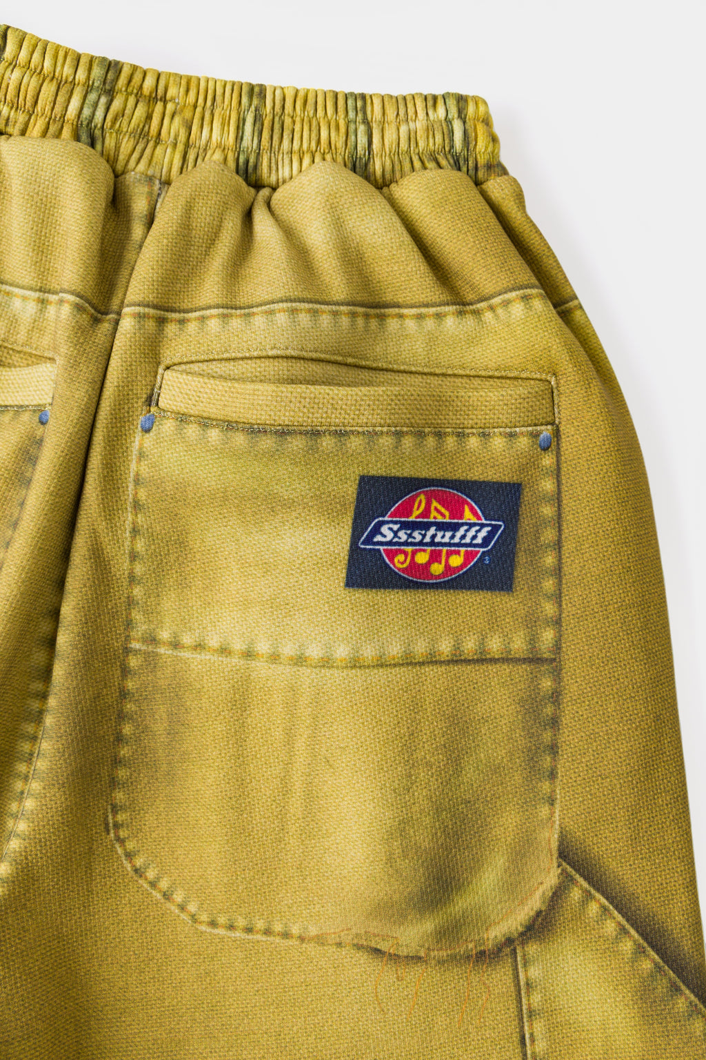 Close-up of the back patch pocket and the woven Ssstufff work label.