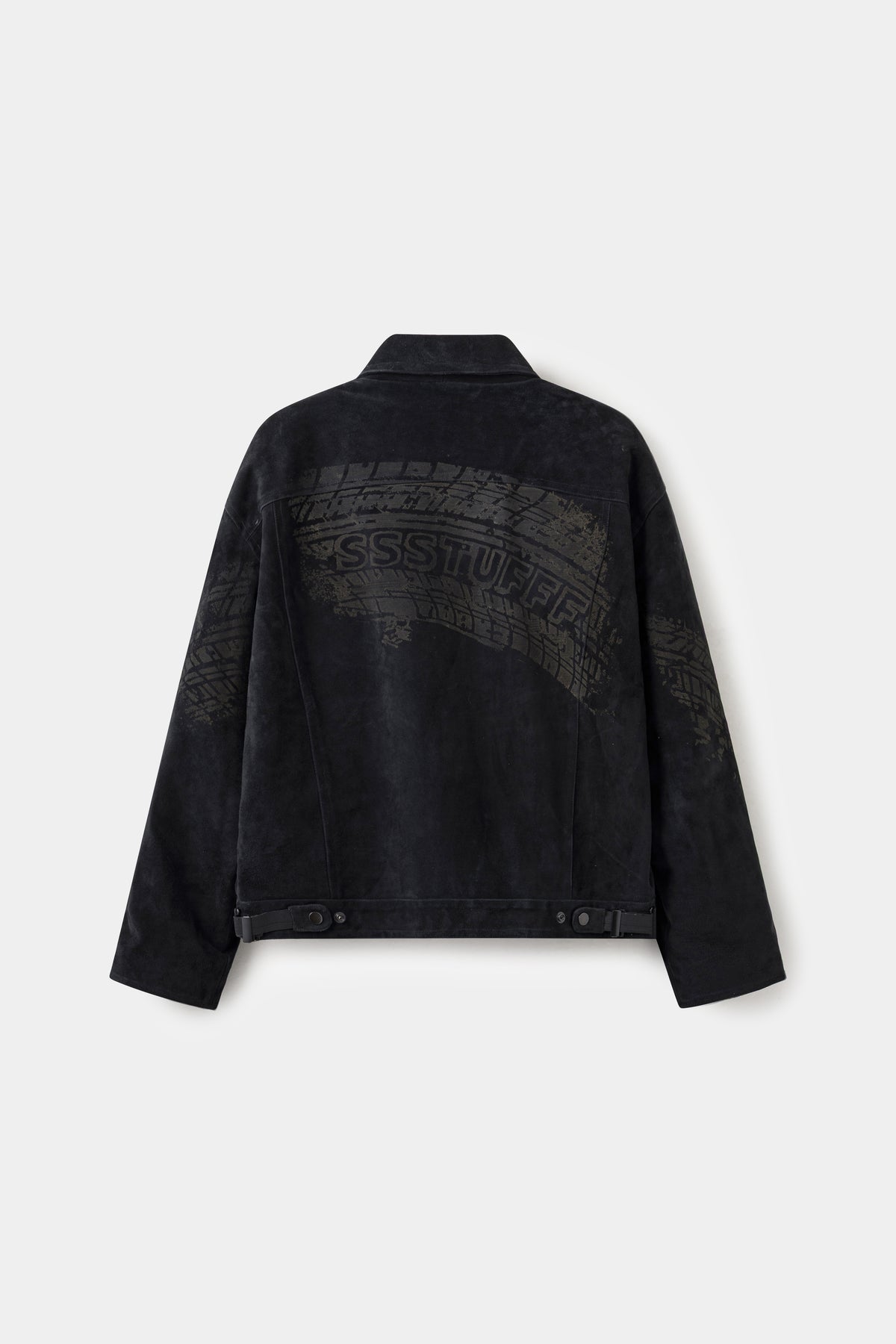 Back view of the black suede jacket, printed with a tyre track carrying the SSSTUFFF name.