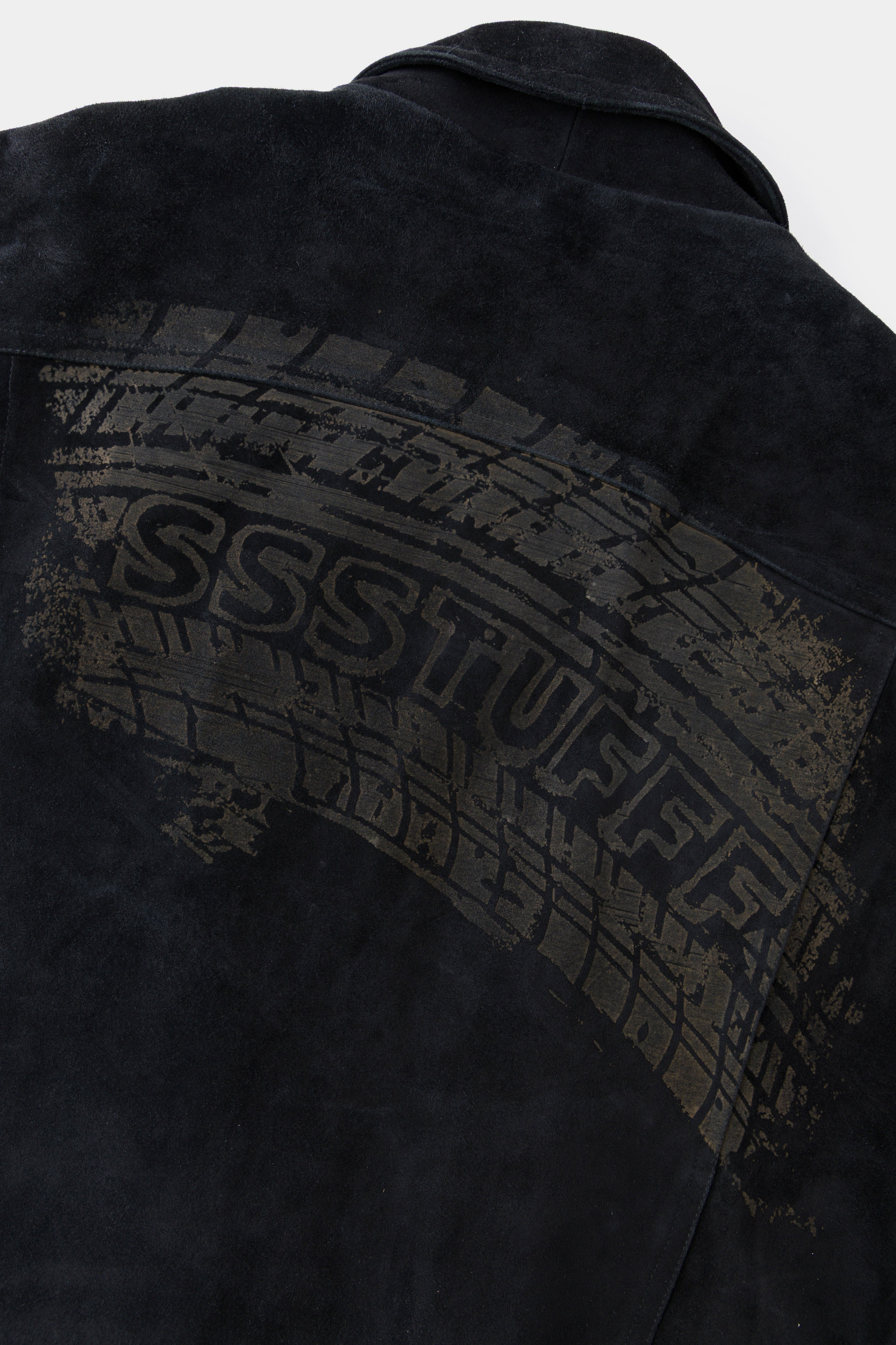 Detail of the tyre track print arcing across the back with SSSTUFFF set into it.