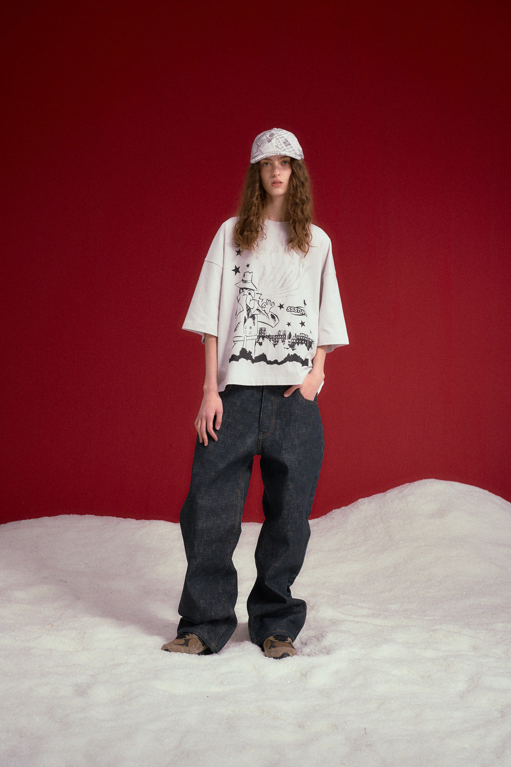 Full-length shot of the model in the UV Smoking Detective Tee and dark jeans.