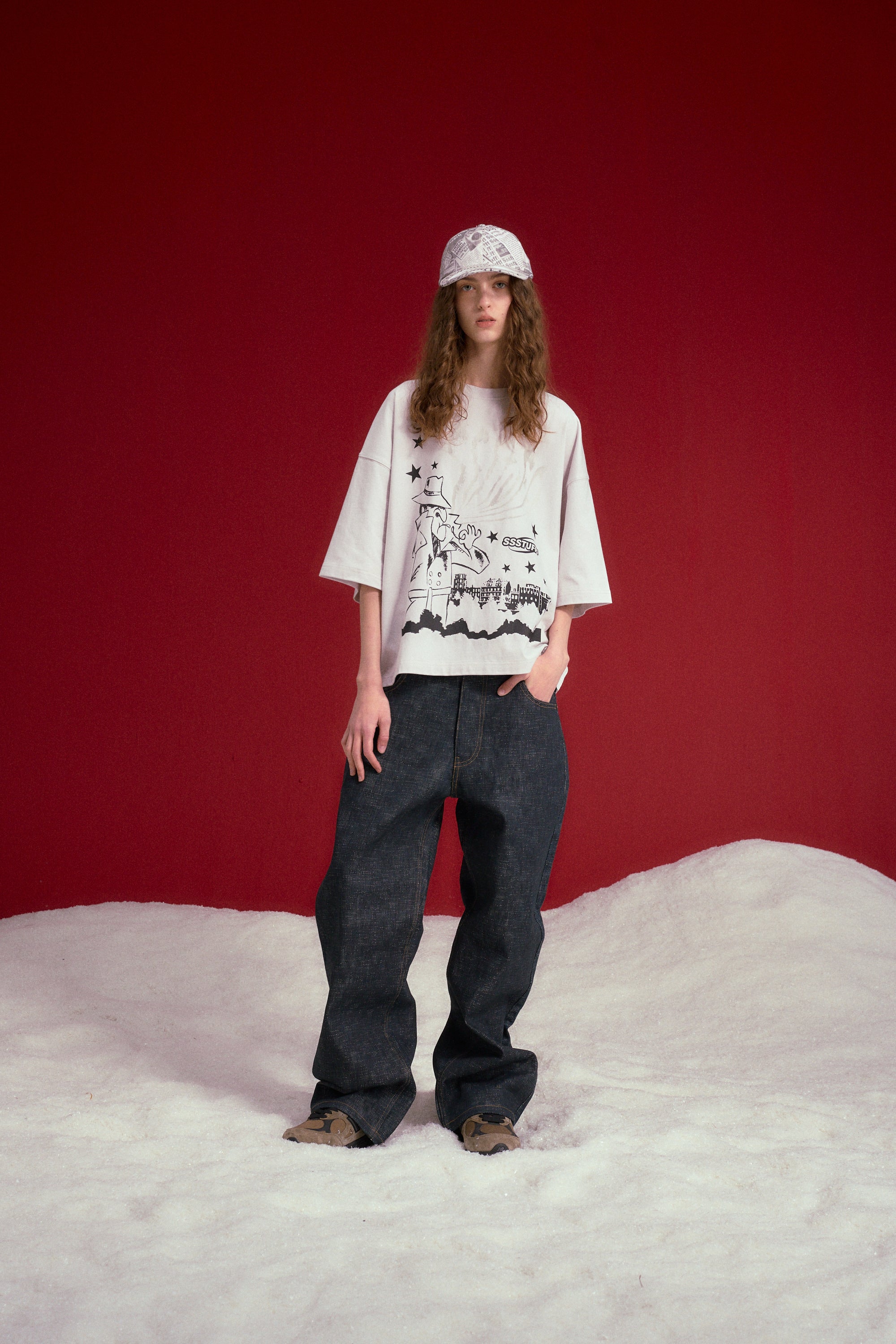 Full-length shot of the model in the UV Smoking Detective Tee and dark jeans.