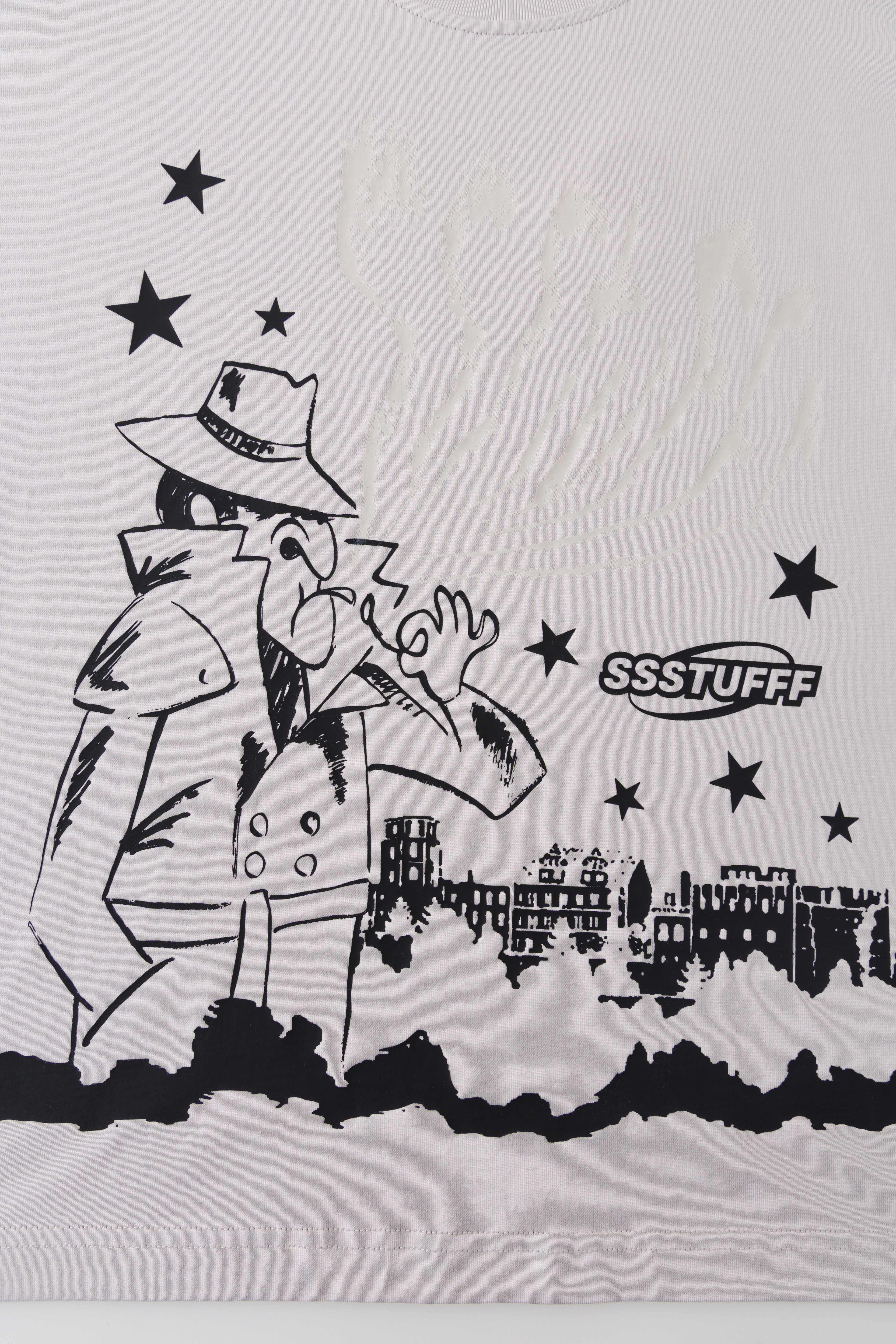 Close-up of the front print before exposure, with clear space above the detective.