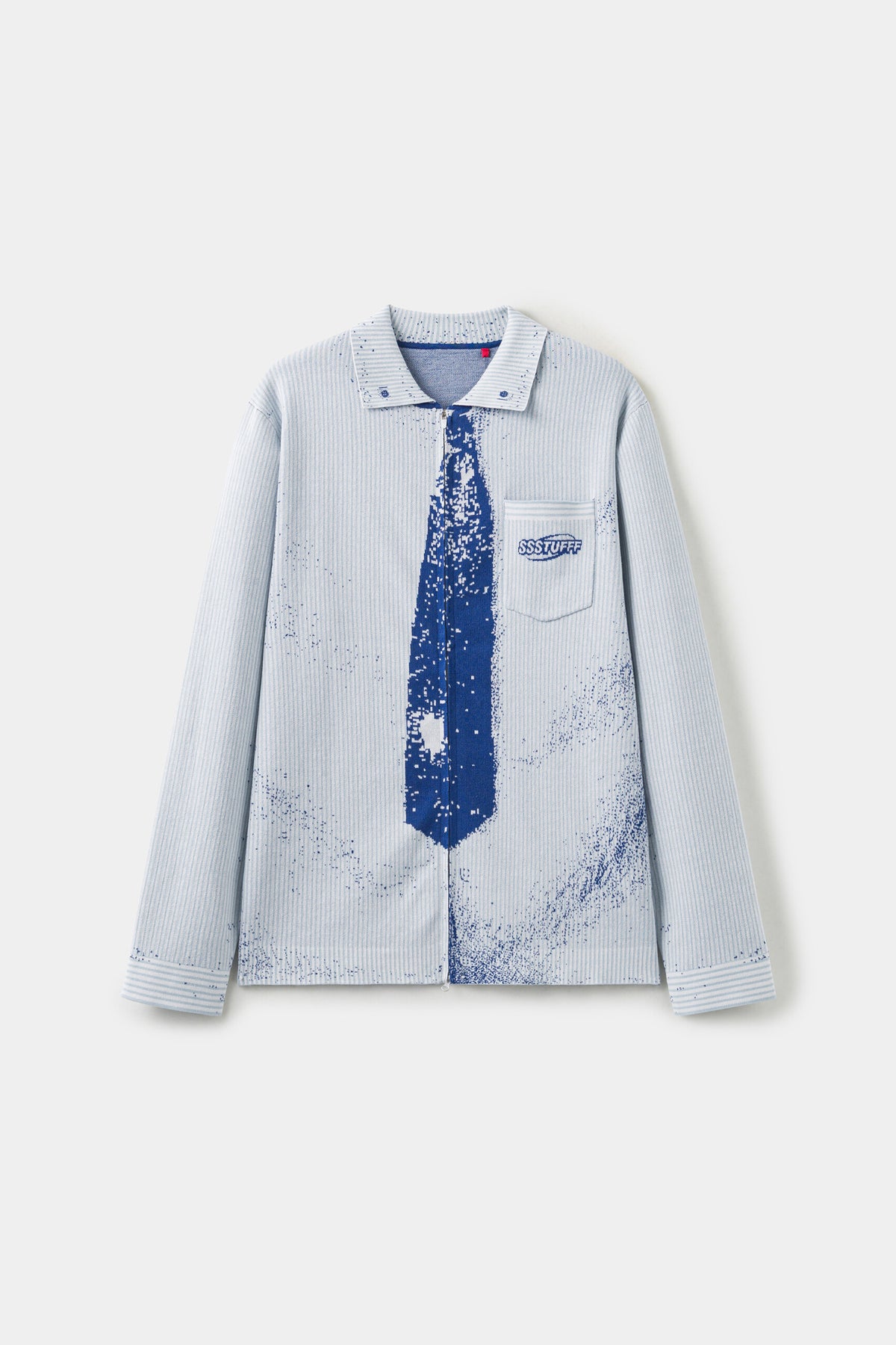 Front view of the pale blue Tie Knit, with the collar, blue necktie and chest pocket knitted as one piece and ink splatter across the body.