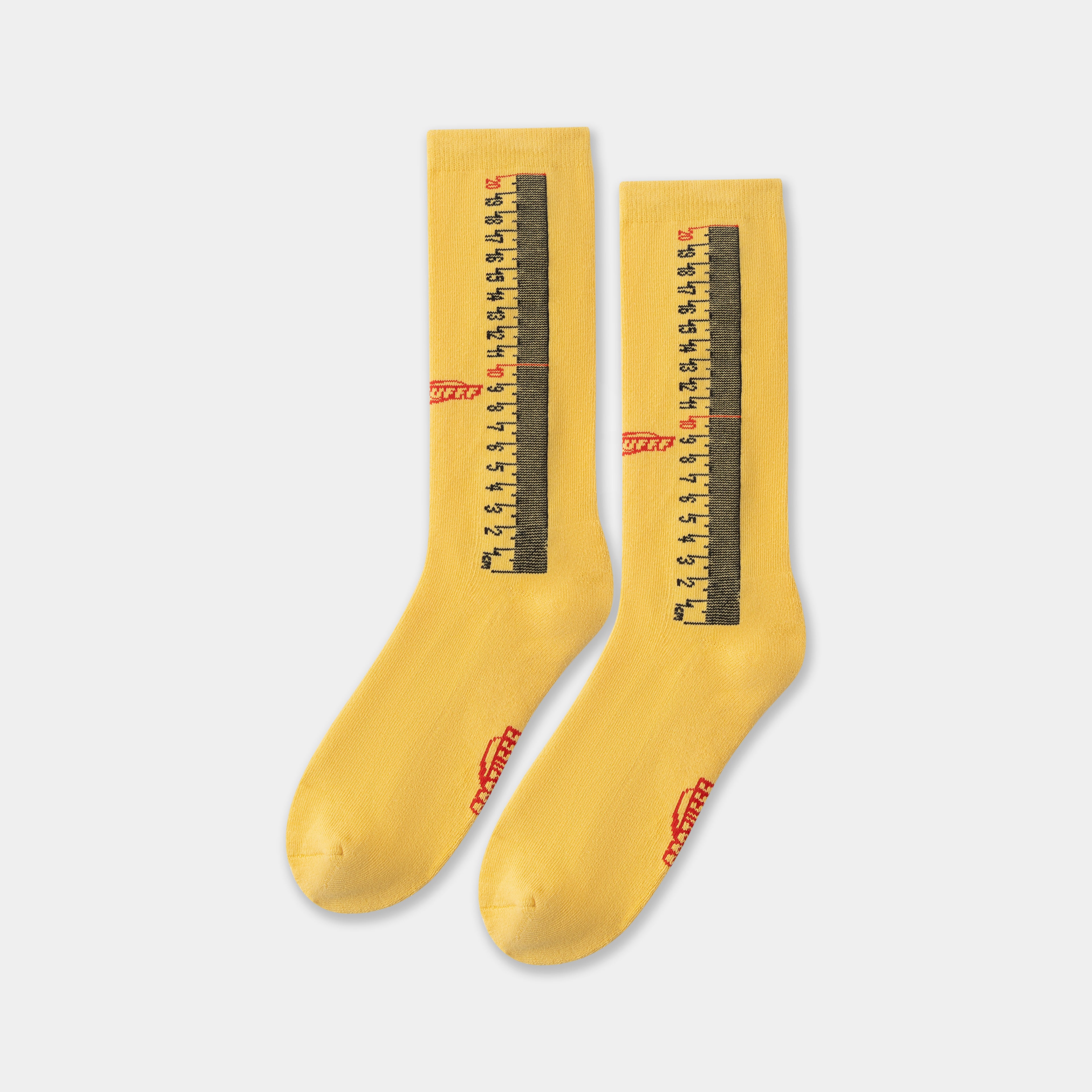 Ruler Socks in yellow, the pair side by side showing the knitted tape-measure markings.