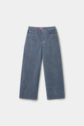 Flock Denim in washed light blue, a flocked wide straight-leg jean with a red SSSTUFFF label at the back waist.
