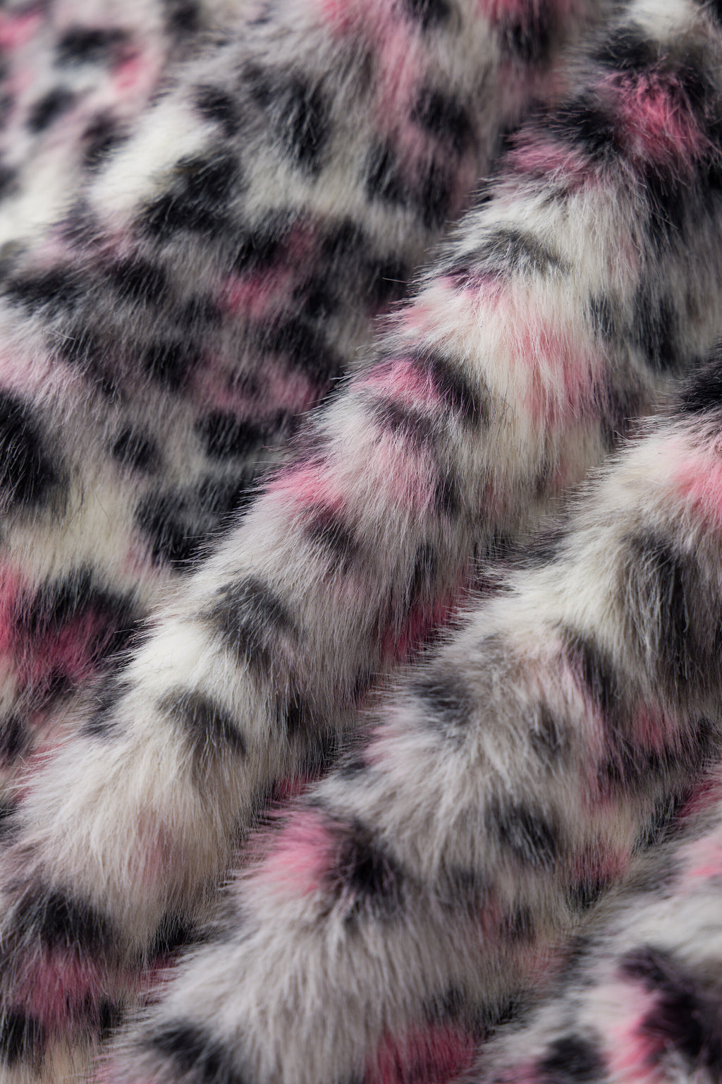 Detail of the pink, black and white leopard print faux fur.