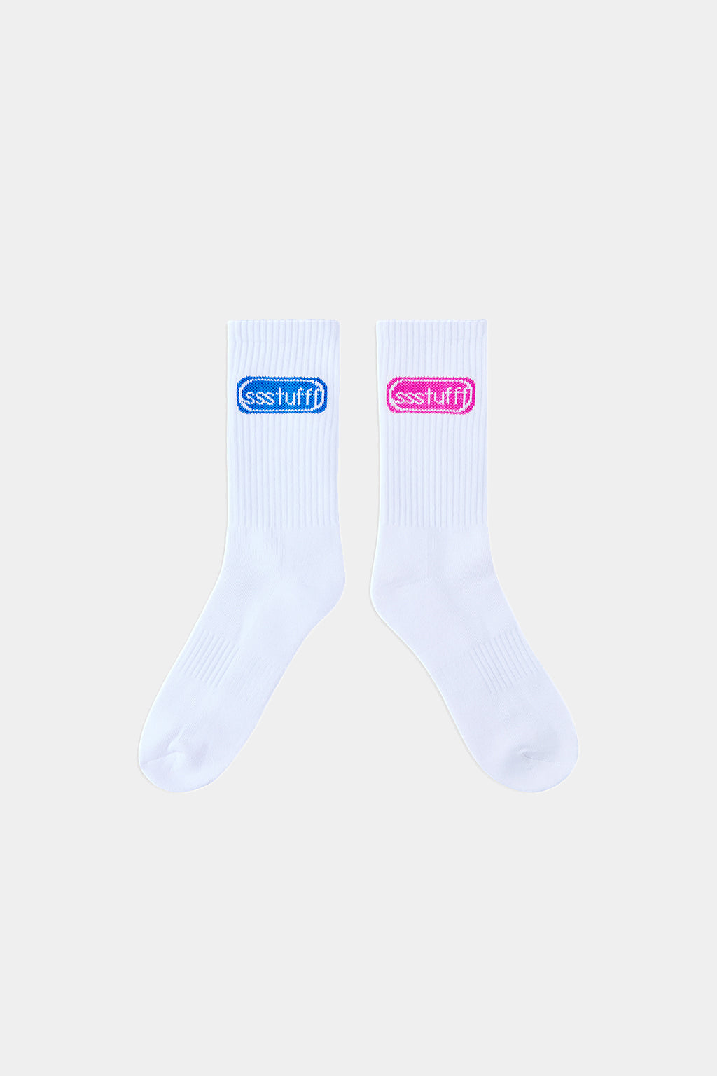 Pair of white ribbed crew socks laid flat, each with a knit ssstufff logo in blue and pink