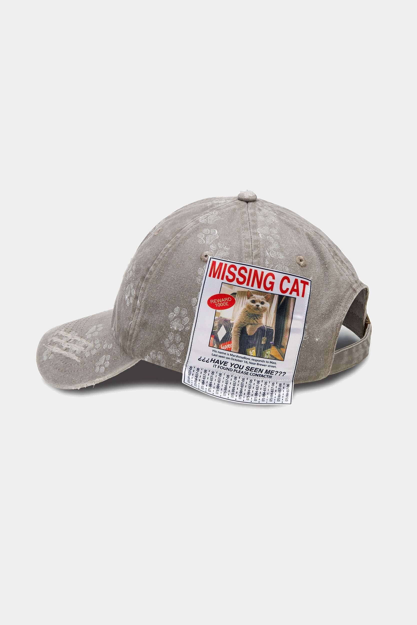 Light grey washed cotton cap with a MISSING CAT poster patch on the front panel