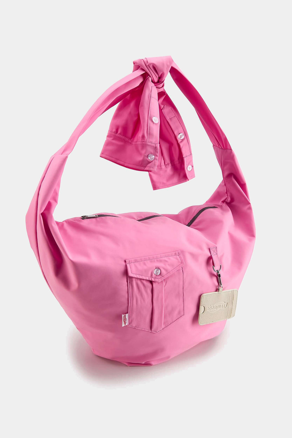 Pink Shirtsleeve Bag seen from the other side, showing the knotted cuff detail and shoulder strap
