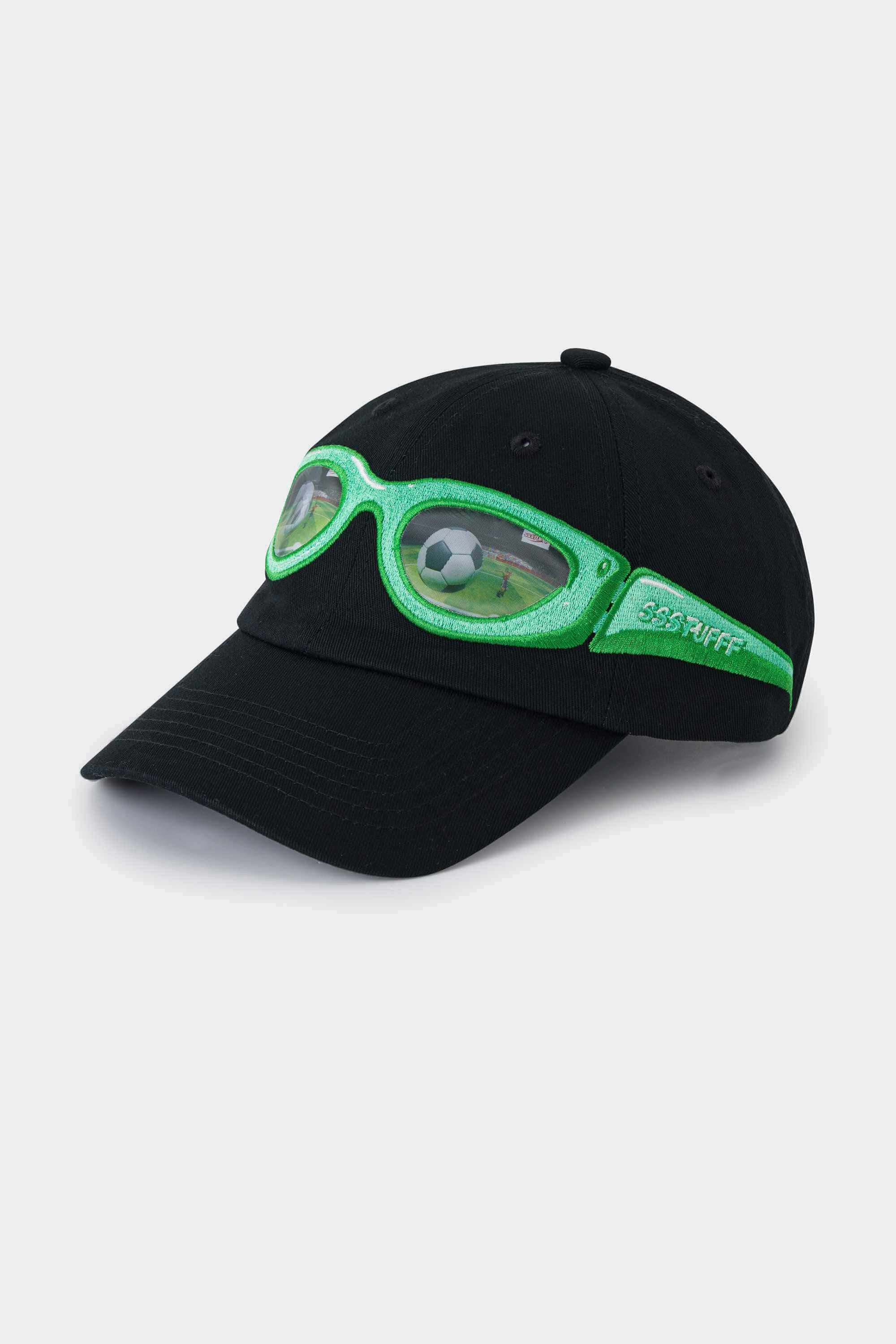 Black cotton cap with a green lenticular sunglasses patch stitched across the front panel and brim