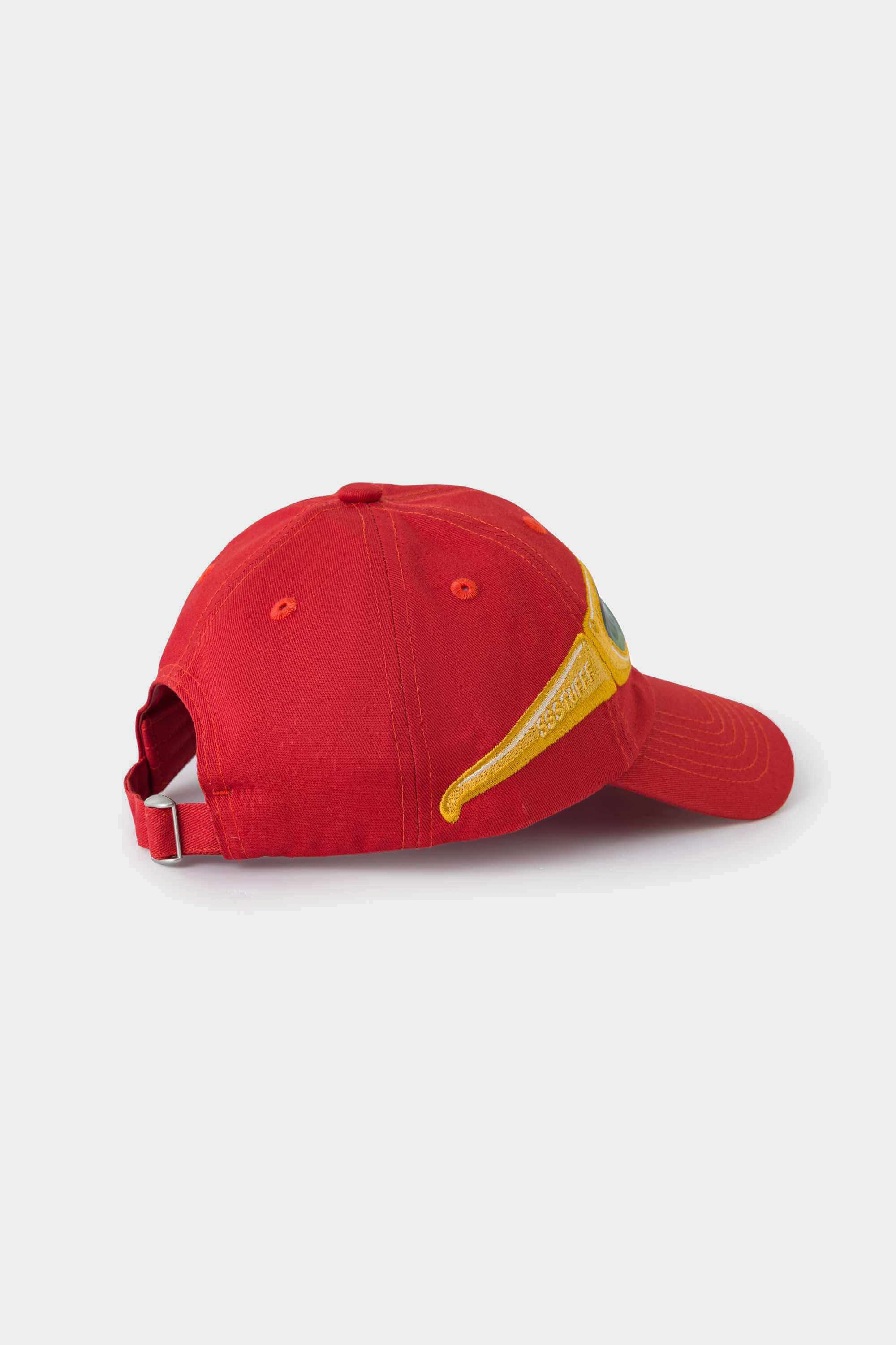 Side view of the red Lenticular Sunglasses Cap, the yellow glasses patch wrapping onto the brim