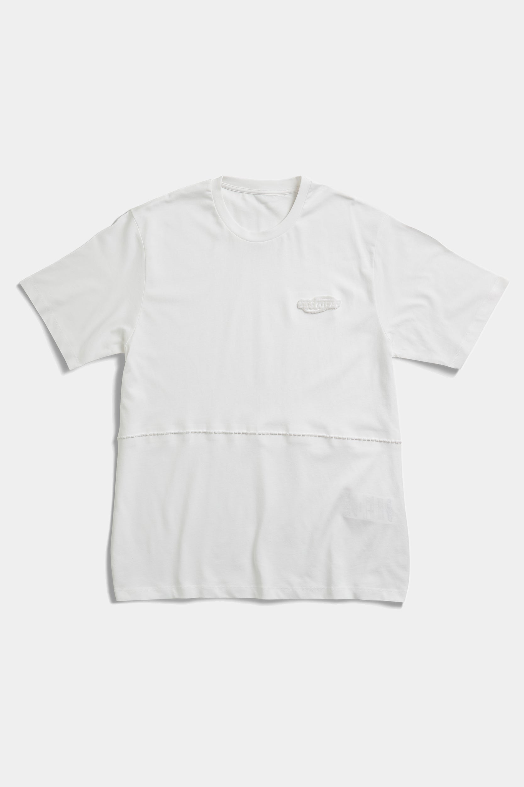 White FUWARI Embroidery Tee laid flat, showing the panelled waist seam and tonal chest embroidery