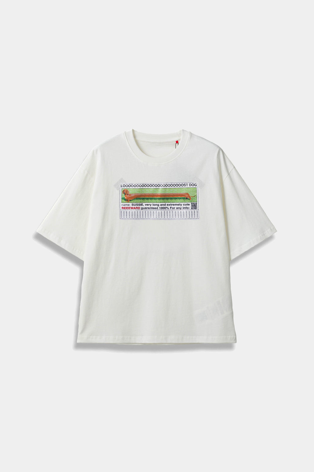 White SSSTUFFF t-shirt with a hand-sewn LOOOOOST DOG poster patch taped to the chest, showing a dachshund and tear-off tabs