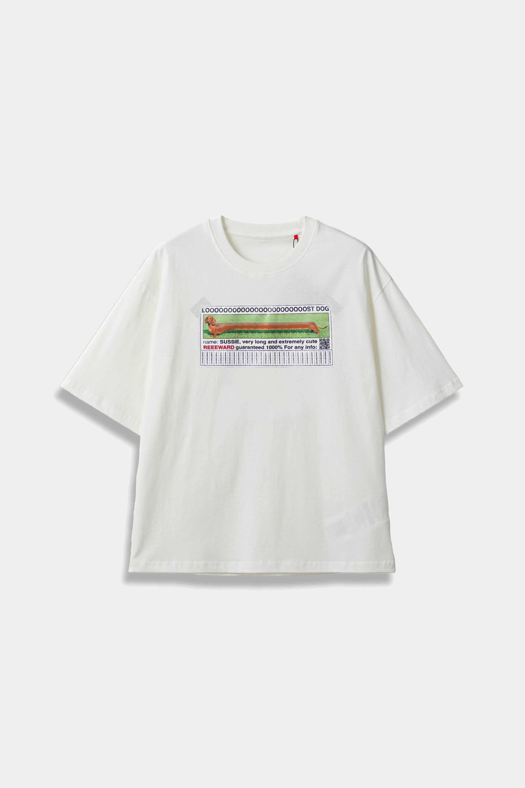 White SSSTUFFF t-shirt with a hand-sewn LOOOOOST DOG poster patch taped to the chest, showing a dachshund and tear-off tabs