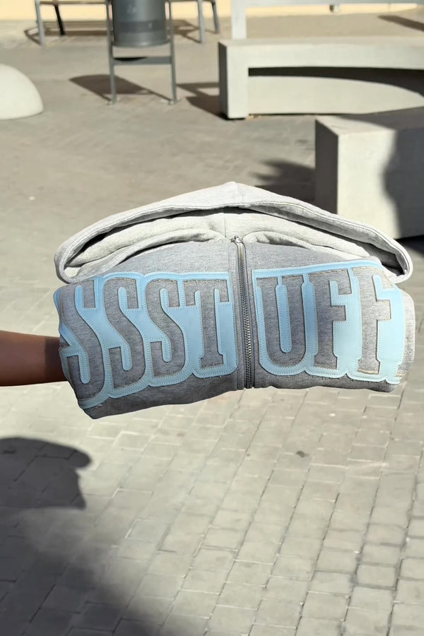 Gray hoodie with 'SSSTUFF' that changed color with UV light
